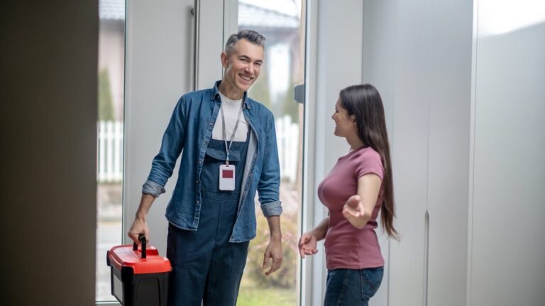 Home service technician greeted by a homeowner at the door, the kind of visit that can help a business get more Google reviews